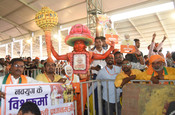 DARBHANGA, MAY 4 (UNI):- BJP supporters during an election meeting to be addressed by Prime Minister Narendra Modi, during Lok Sabha poll, in Darbhanga on Saturday. UNI PHOTO-103U
