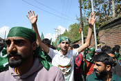 SRINAGAR, APR 24 (UNI):- PDP supporter's at a rally in Srinagar as they accompany their leader Waheed Ur Rehman Para to filing his nomination for the Parliamentary elections, on Wednesday. UNI PHOTO-75U