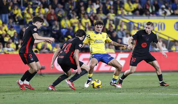 Barca stays top in La Liga after win in Las Palmas while Atletico beats Valencia