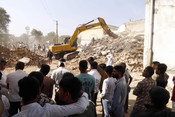 AHMEDABAD, DEC 16 (UNI): JCB machines being used to demolish illegal residences near Sardar Vallabh Bhai Patel international Airport as part of the mega demolition drive by Ahmedabad Municipal Corporation (AMC), in Ahmedabad on Tuesday. UNI Photo 59U