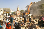 AHMEDABAD, DEC 16 (UNI): JCB machines being used to demolish illegal residences near Sardar Vallabh Bhai Patel international Airport as part of the mega demolition drive by Ahmedabad Municipal Corporation (AMC), in Ahmedabad on Tuesday. UNI Photo 60U
