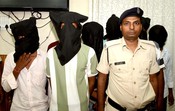 Patna, JULY 15 (UNI) :- Police escort robbers during a press conference regarding advocate Jitendra Mahto murder case, in Patna. on Tuesday. UNI PHOTO - 98U Patna, JULY 15 (UNI) :- Police escort robbers during a press conference regarding advocate Jitendra Mahto murder case, in Patna. on Tuesday. UNI PHOTO - 98U