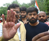 NEW DELHI, JULY 21 (UNI):-Shiv Sena (UBT) MP Sanjay Raut meets CJP founder Abhijit Dipke and supporters during a sit-in protest at Jantar Mantar, demanding the resignation of Union Education Minister Dharmendra Pradhan, in New Delhi on Tuesday. UNI PHOTO BY RD36U RANJAN DIMRI