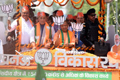 LUCKNOW, APR 29 (UNI):- Defence Minister and BJP candidate for Lucknow Parliamentary seat Rajnath Singh with Uttar Pradesh Chief Minister Yogi Adityanath and Uttarakhand Chief Minister Pushkar Singh Dhami and others on way to file nomination for the Lok Sabha Election -2024, in Lucknow on Monday.UNI PHOTO-24U